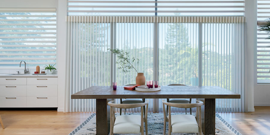 Luminette vertical sheer on a sliding glass door with Pirouette shades on living room windows