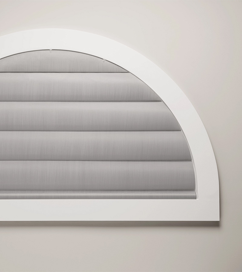 arched window with gray window covering nova scotia