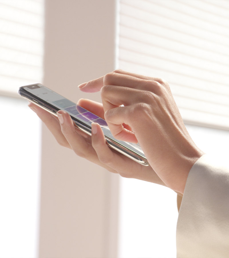 hands using app on cellular device for automation