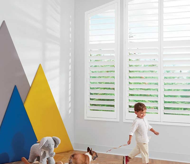childrens room with white window shutters angled in nova scotia