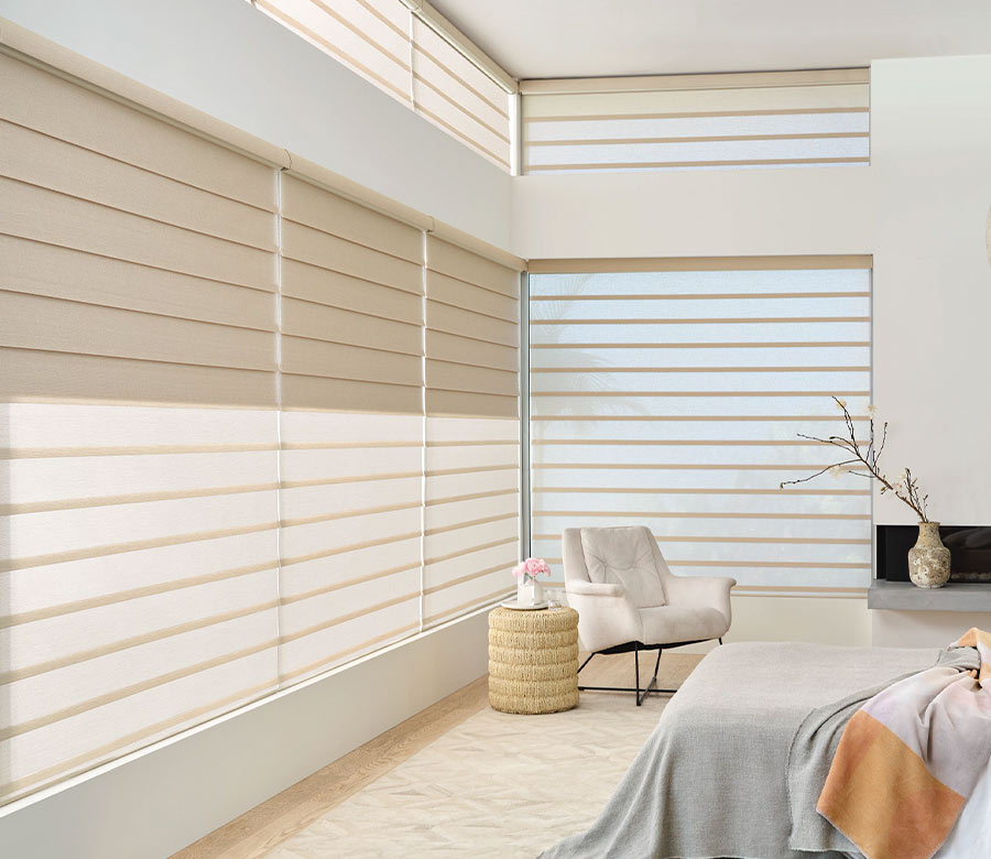 floor to ceiling tan roman shades in bedroom