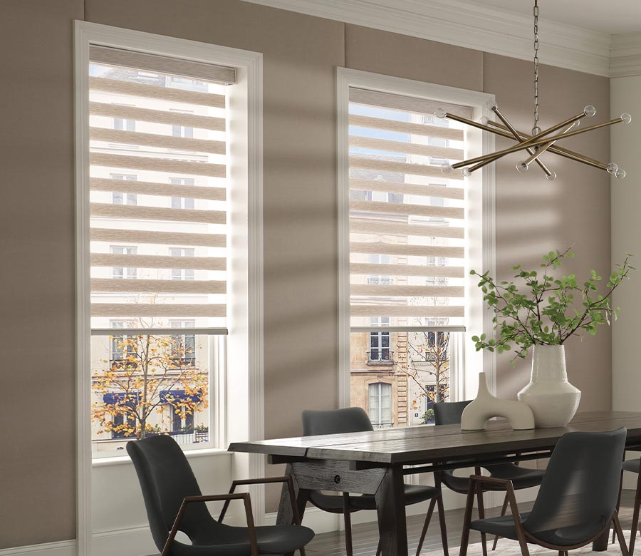 dining room with cream fabric window shades with black furniture