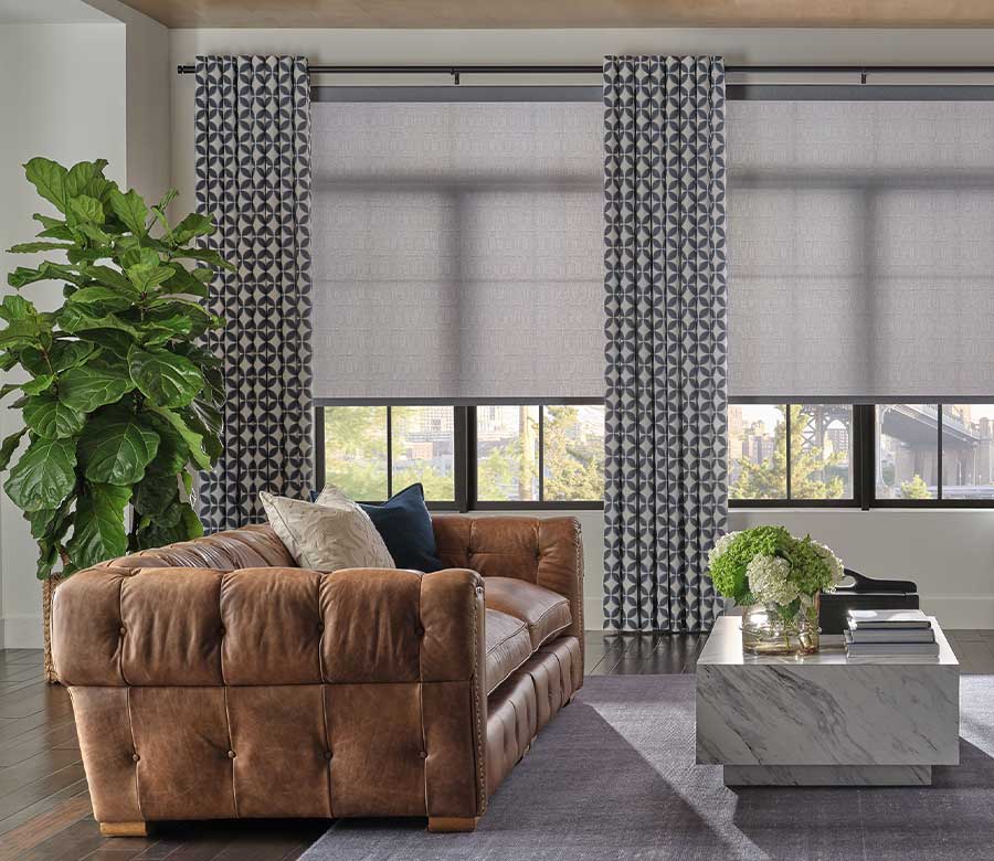 patterned window drapery with gray roller window shades in nova scotia
