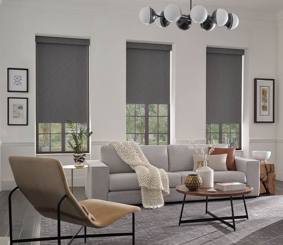 three gray designer roller window shades with dual shade solutions