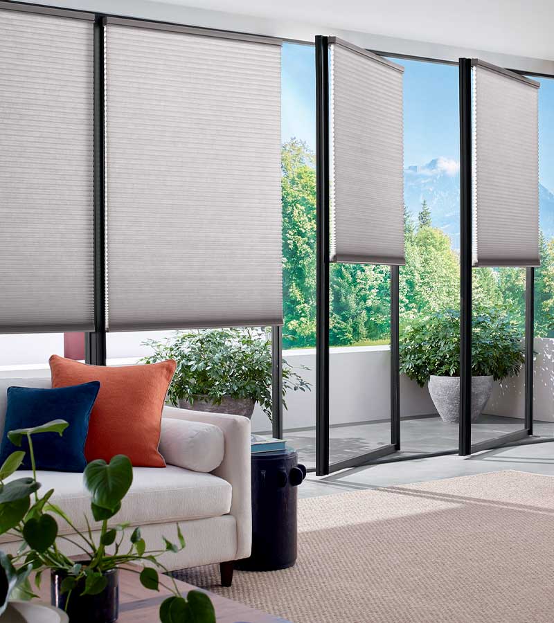 tilt and turn glass doors with cellular window shades in living room