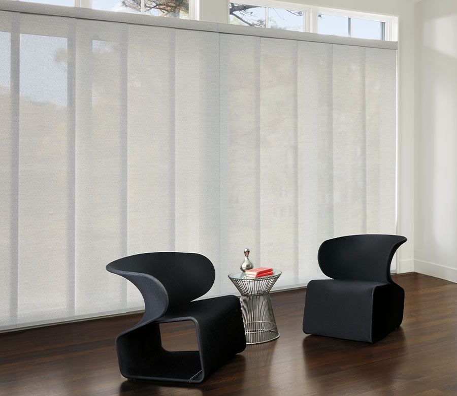 large white modern sliding window panels with black chairs