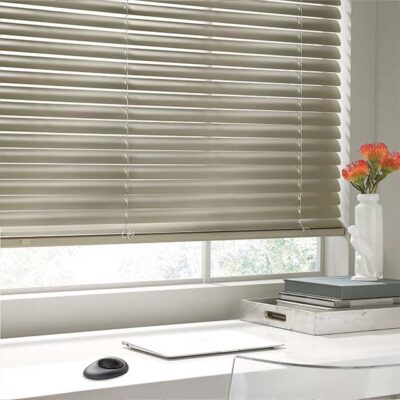 modern-precious-metals gold metal window blinds on white framed window with orange flower and black pebble remote