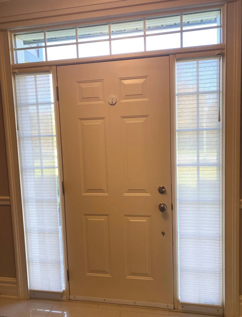 privacy sheers next to front door in entryway