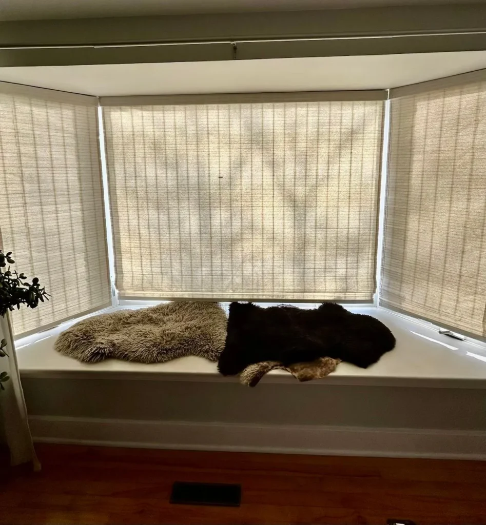 recent work of neutral woven wood shades on window seat
