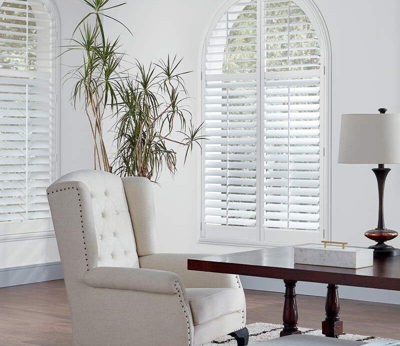 arched windows with white window shutters nova scotia