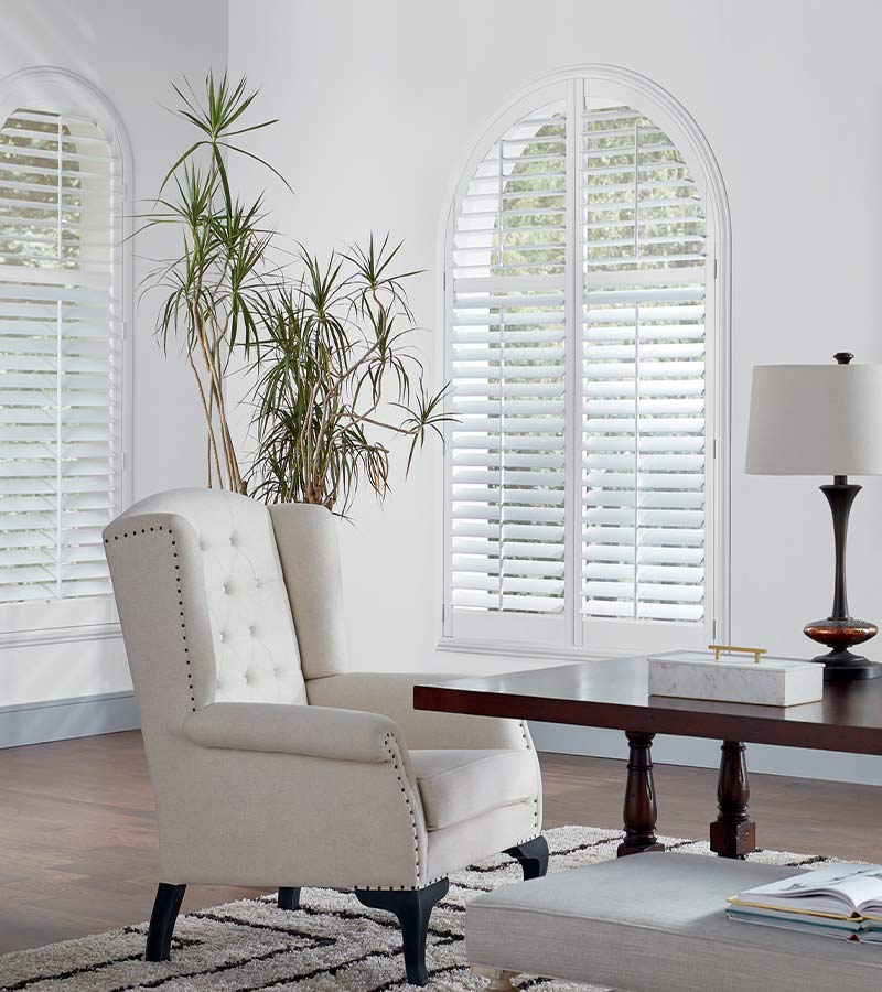arched windows with white window shutters nova scotia