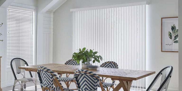 dining room with vertical blinds on glass door