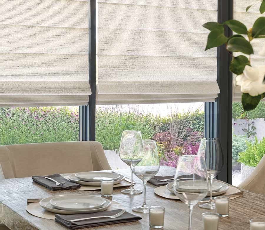 dining room with woven roman shades