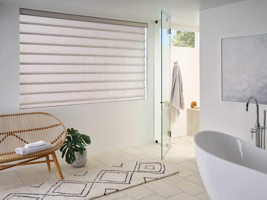 Rolling Roman shades in modern bathroom in Nova Scotia home