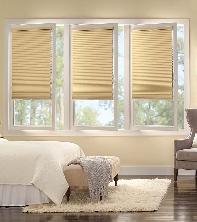 tilt-and-turn-custom-guest-bedroom-european-window-treatments-gotcha-covered-seeview-nova-scotia bedroom with cream tilt and turn honeycomb window shades