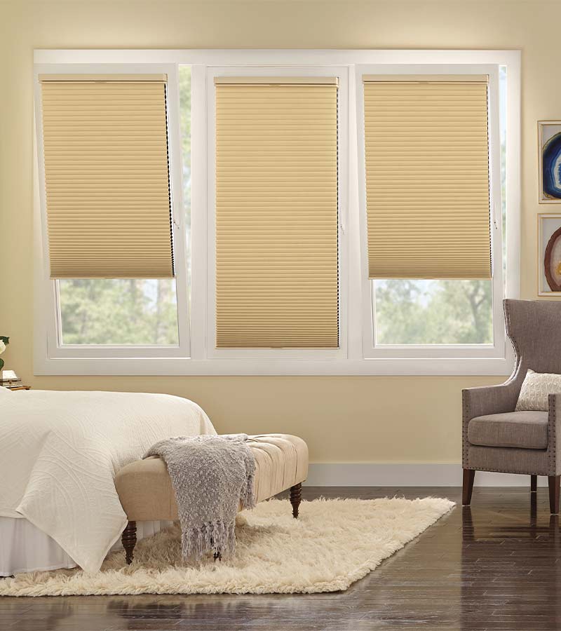 tilt-and-turn-guest-bedroom-european-window-treatments-gotcha-covered-seeview-nova-scotia guest bedroom with cream tilt and turn window treatments on european windows