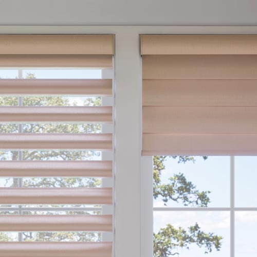 Motorized Pirouette shades with PowerView Automation adjusting two different windows with different settings