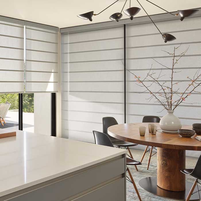 wall to wall windows covered with architectural roller shades