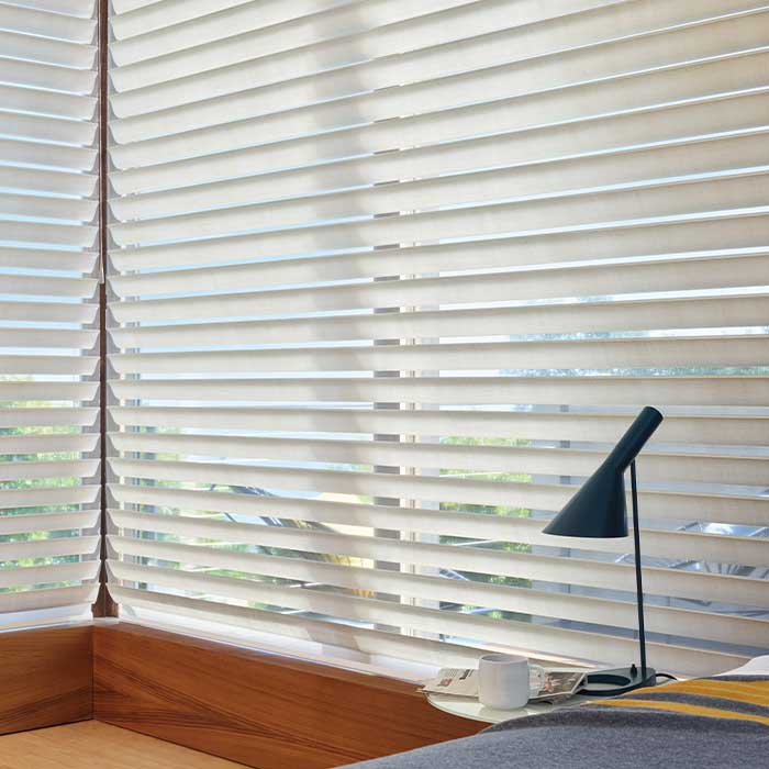 Silhouette® window shades on large bedroom windows for privacy