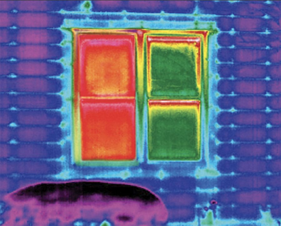 infrared image depicting energy loss on bare window and energy efficiency on covered window